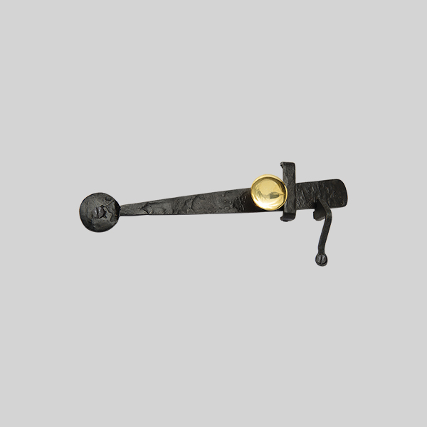 Shown with a dark wax iron finish and polished brass button.