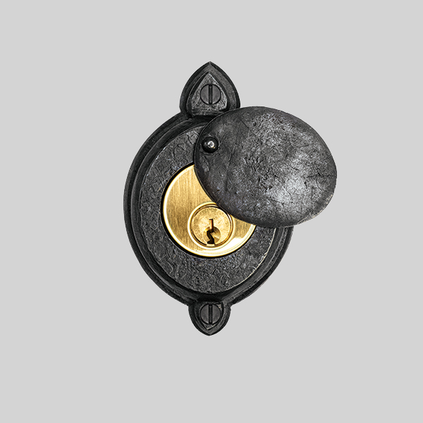 Shown with a dark wax iron and polished brass finish.