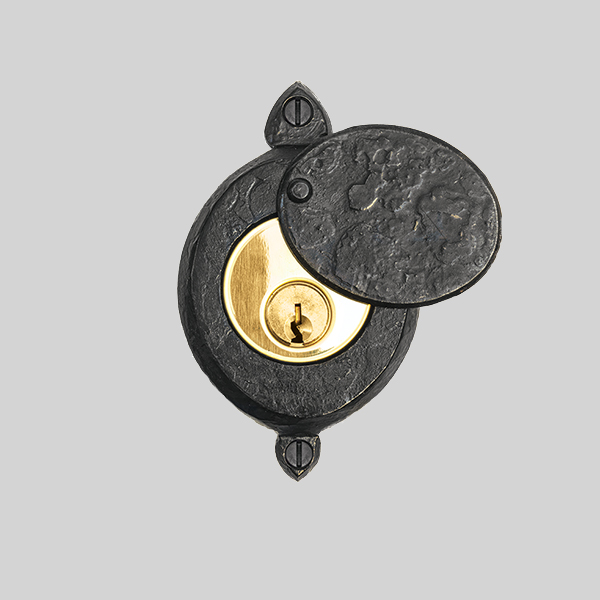 Shown with a dark wax iron and polished brass finish.