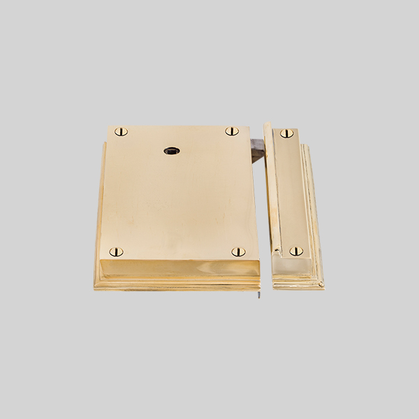 Shown as right hand with a polished brass finish.