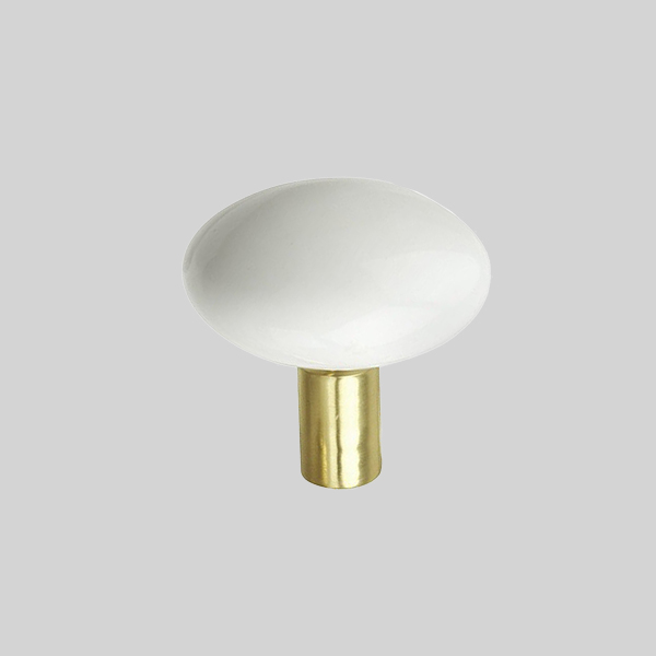 Shown in white porcelain with polished brass finish.