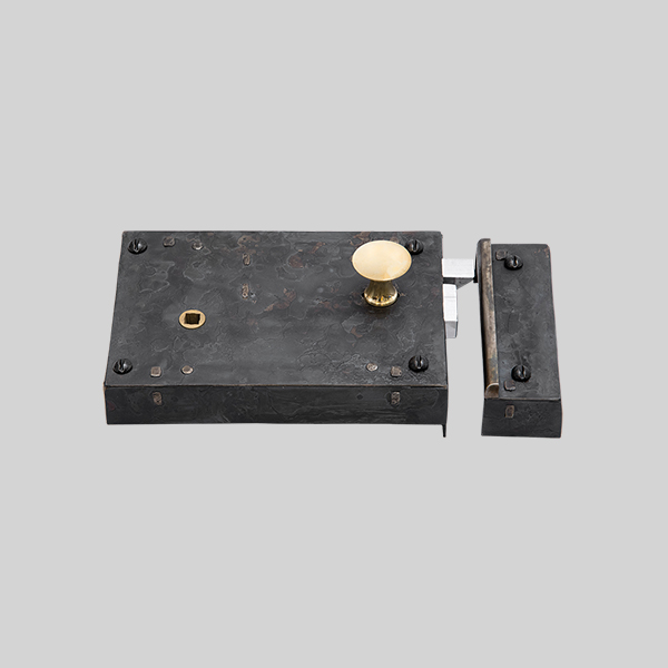 Shown as right hand with a dark wax iron finish.